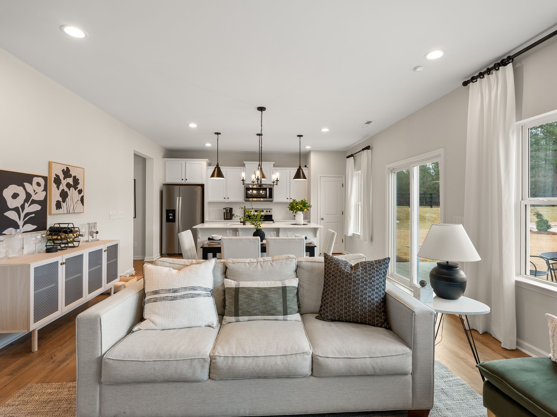 A living room with a couch and a lamp in it