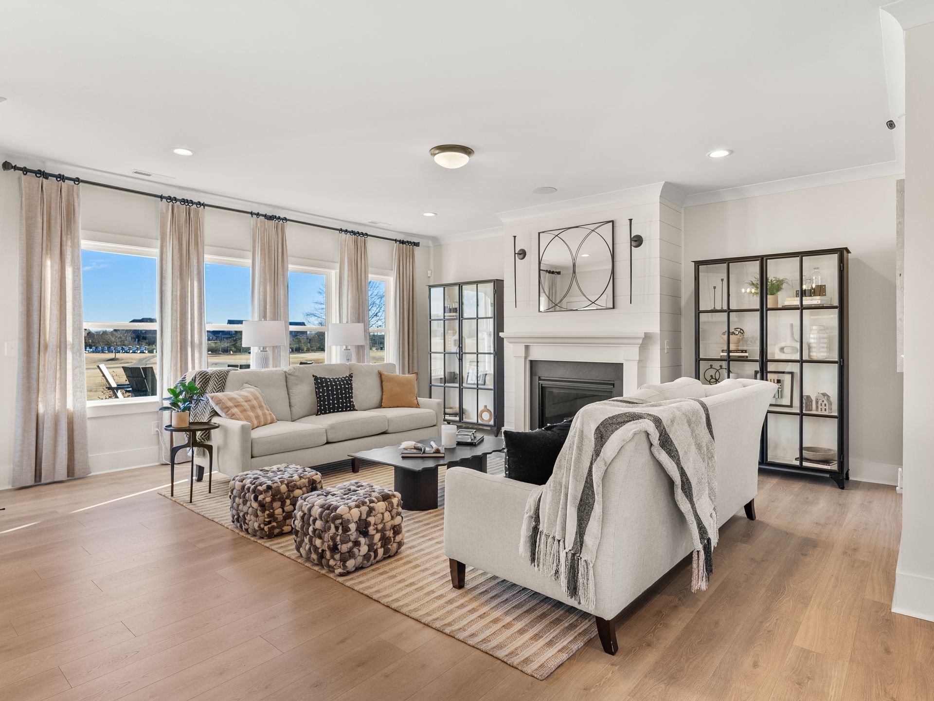 A living room filled with furniture and a fireplace.