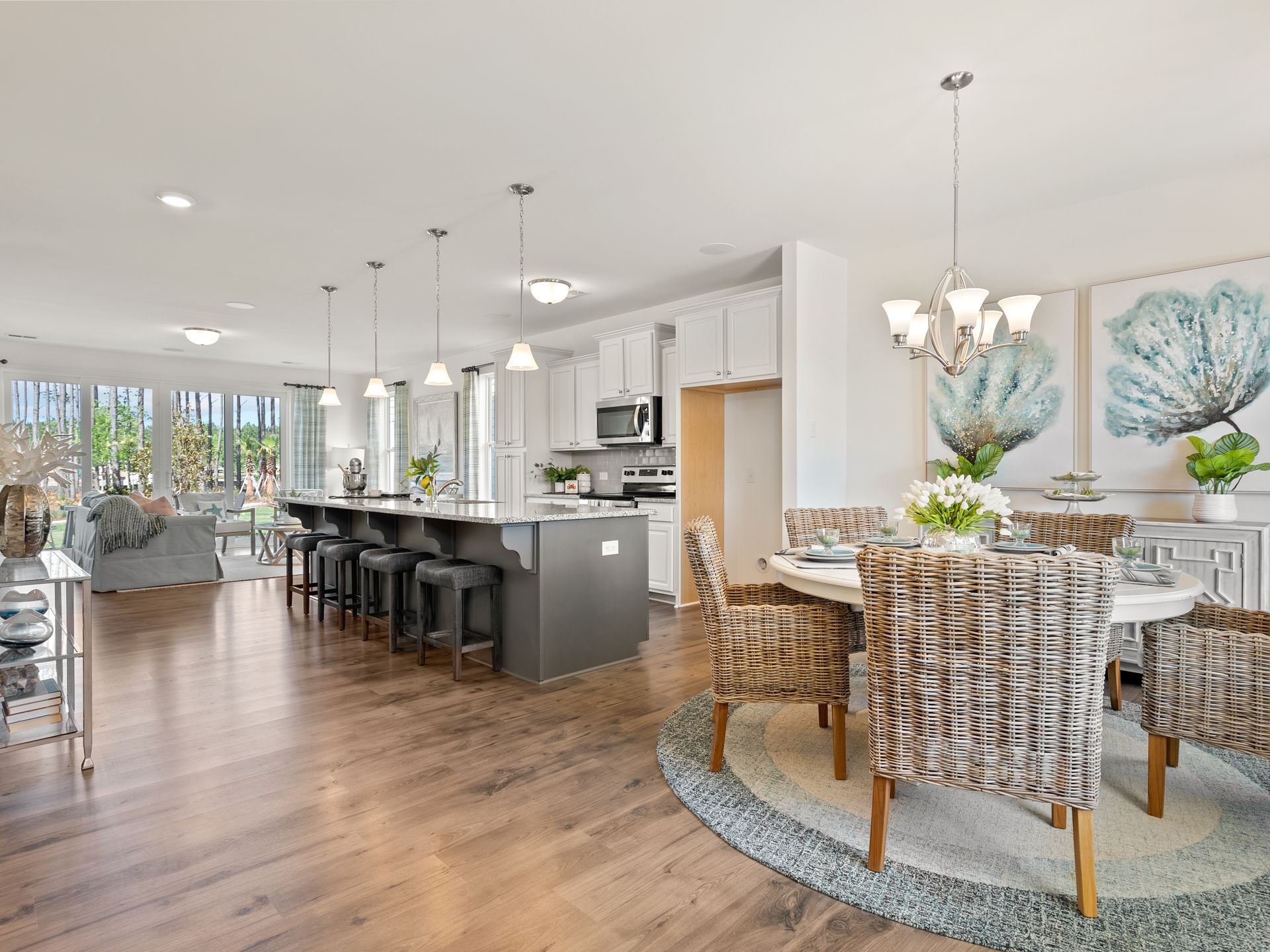 There is a dining room table and chairs in the middle of the room.
