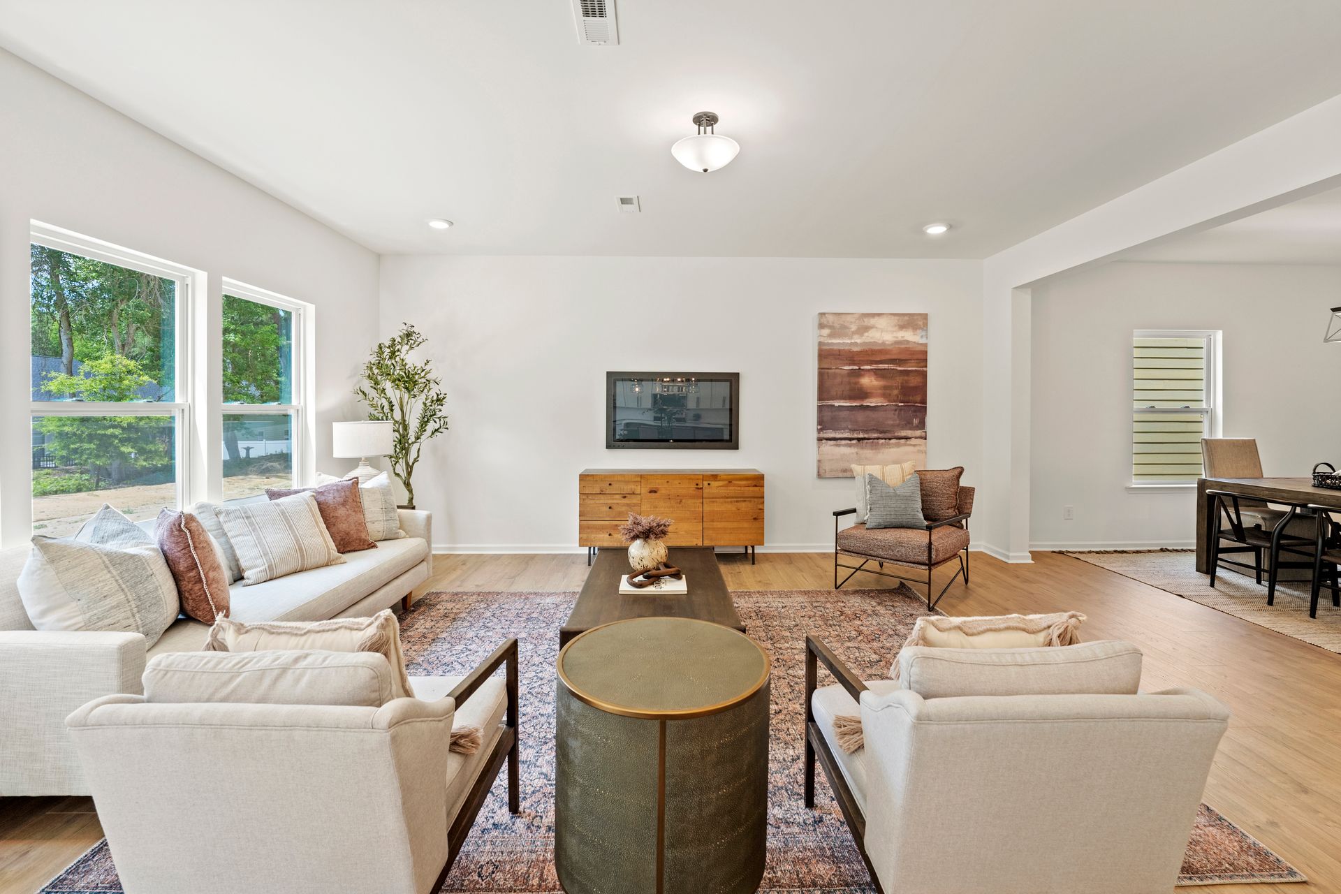 A living room filled with furniture and a television.