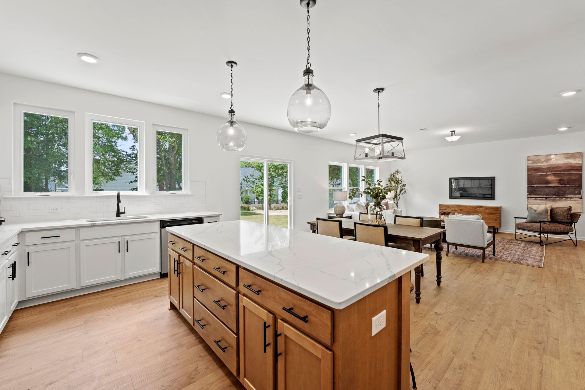A kitchen with a large island in the middle of the room.