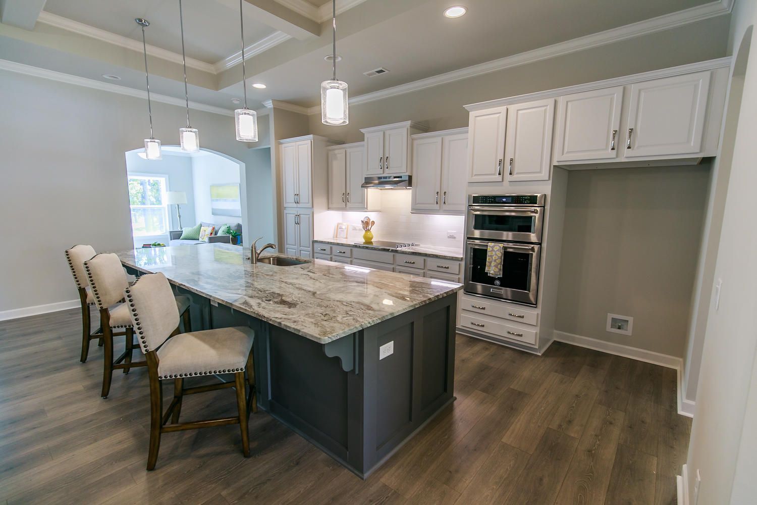There is a large island in the middle of the kitchen.