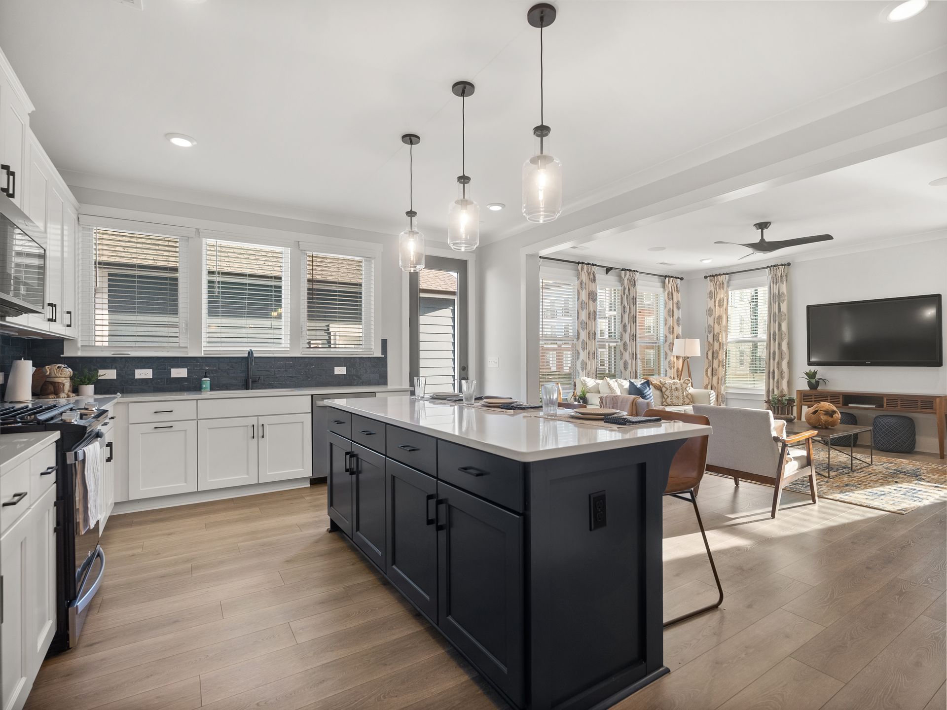 There is a large island in the middle of the kitchen.