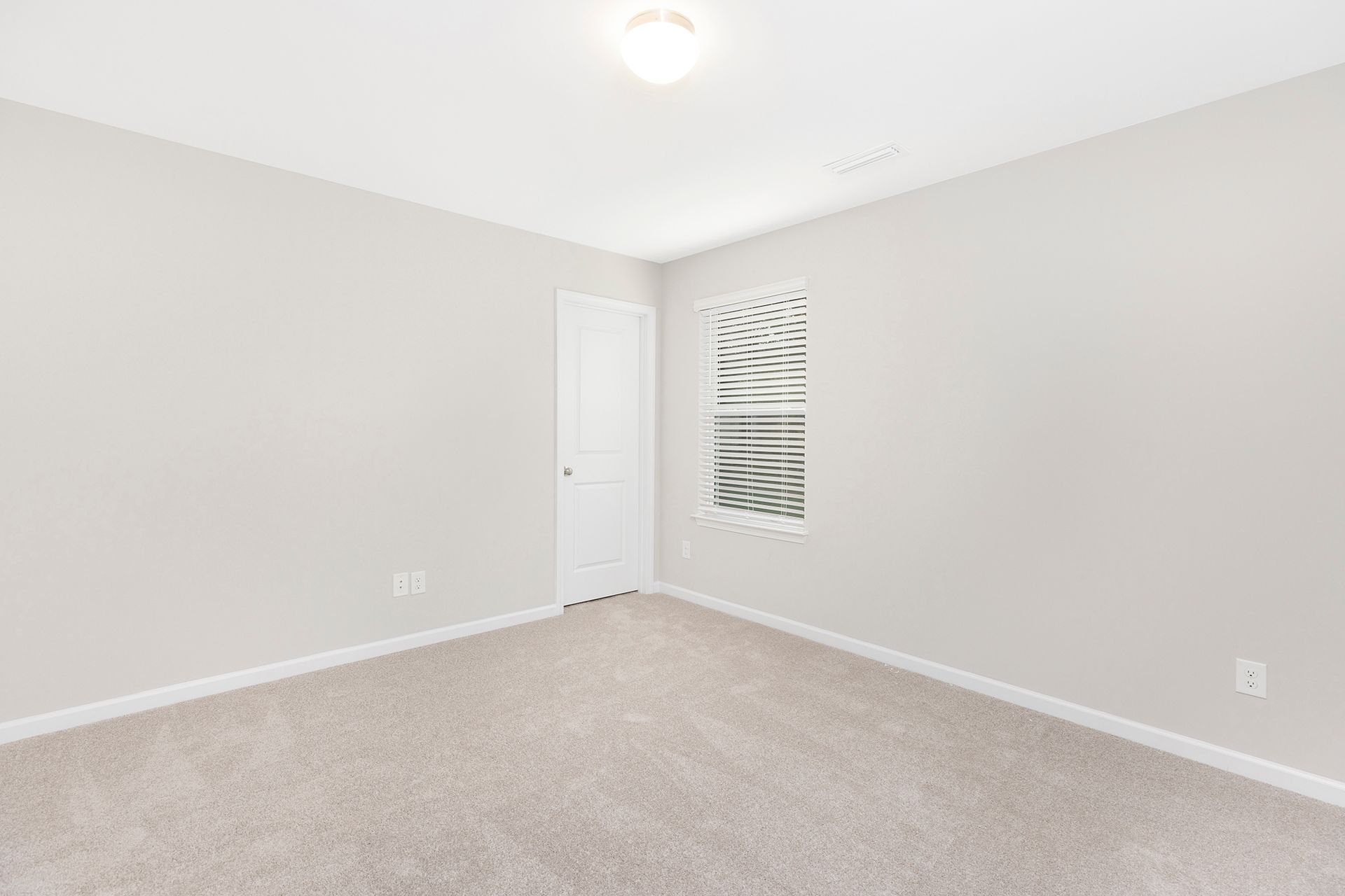 There is a window in the corner of the room.