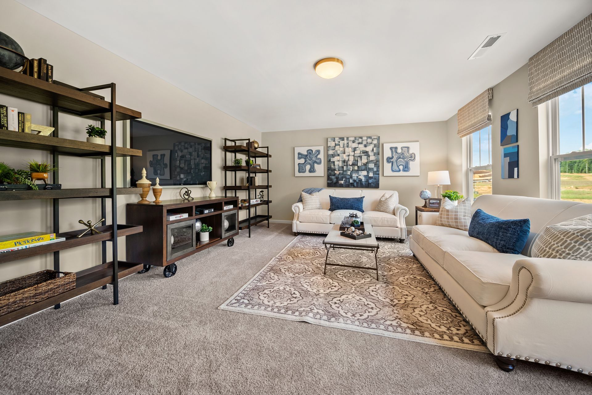A living room with a couch , table , and shelves.