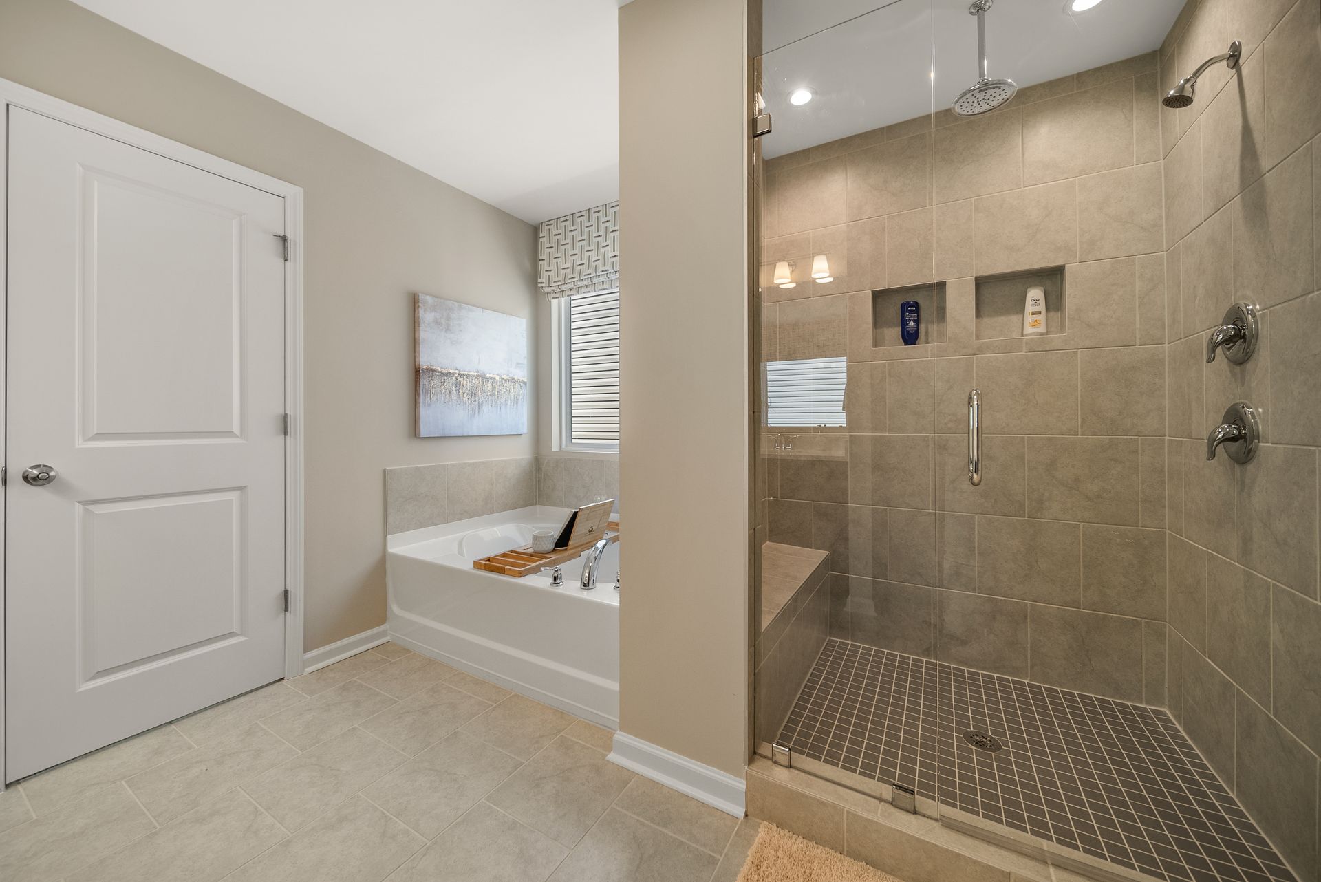 A bathroom with a walk in shower and a bathtub.