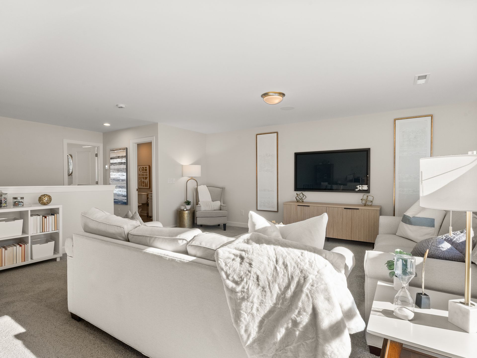 A living room filled with furniture and a flat screen tv.