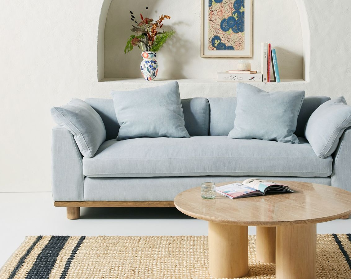 A living room with a couch and a coffee table