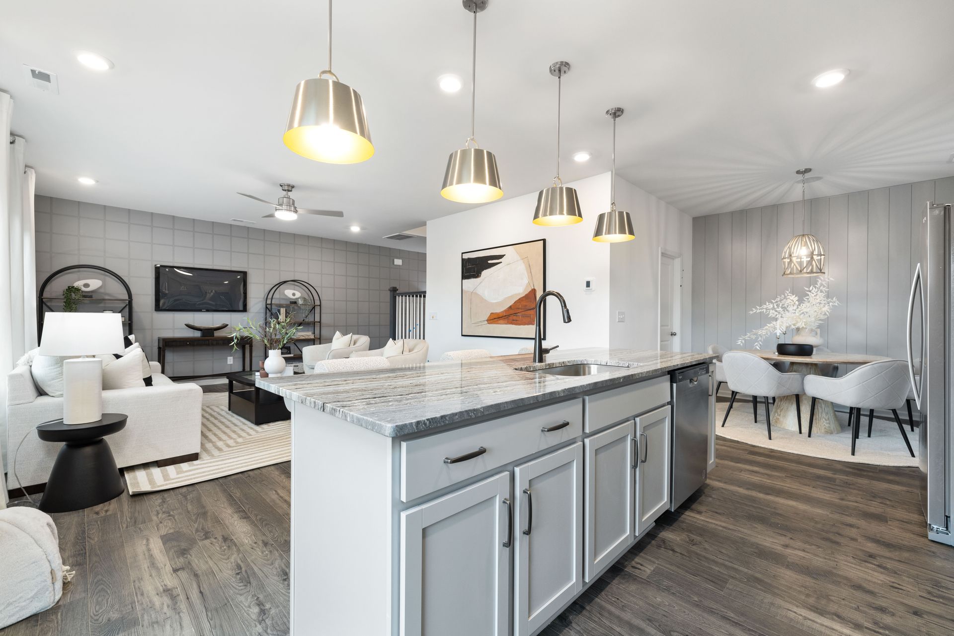 A kitchen with a large island in the middle of the room.
