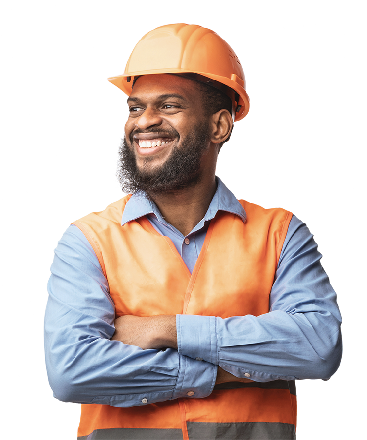 A man wearing a hard hat and safety vest is smiling with his arms crossed.