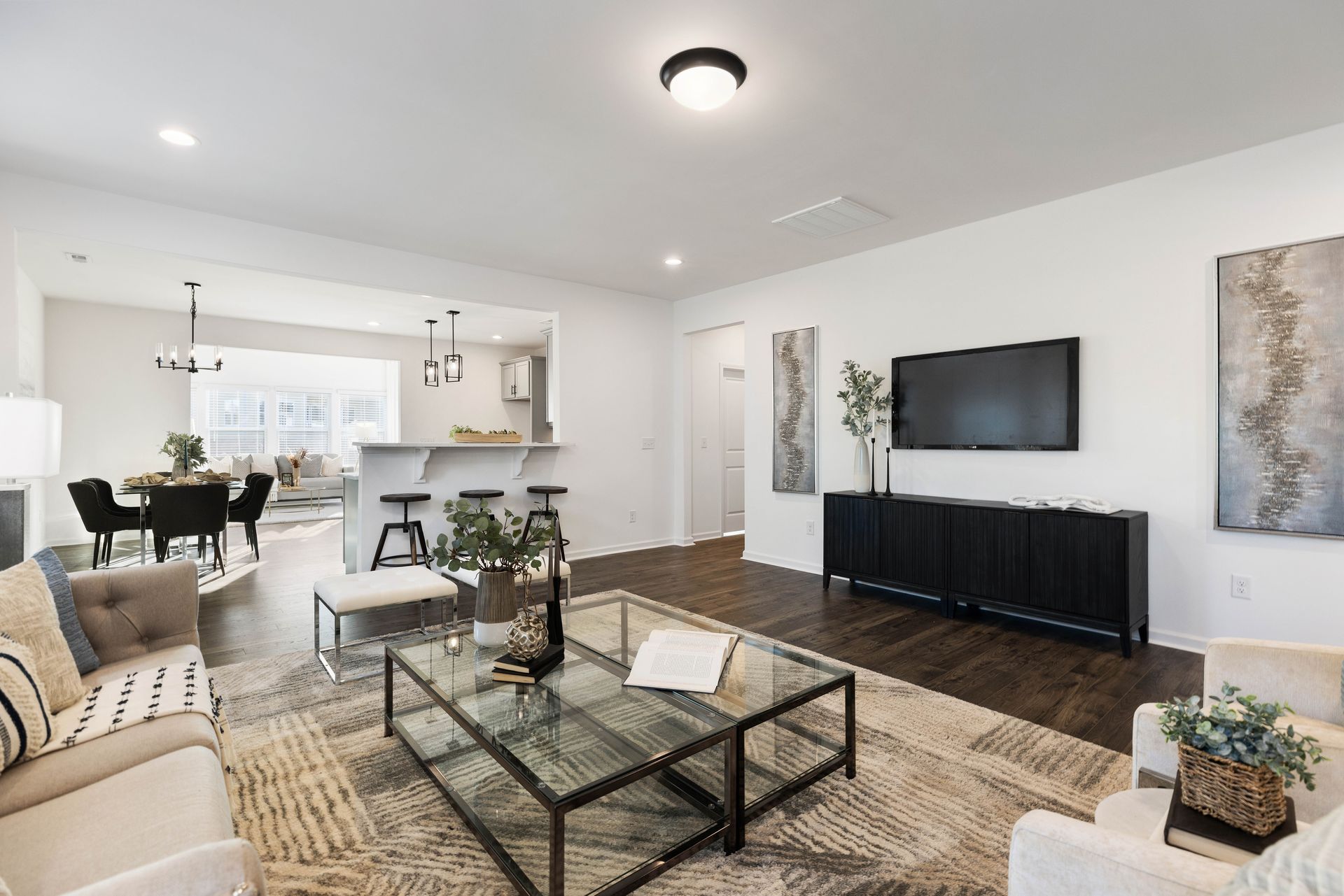 A living room filled with furniture and a flat screen tv.