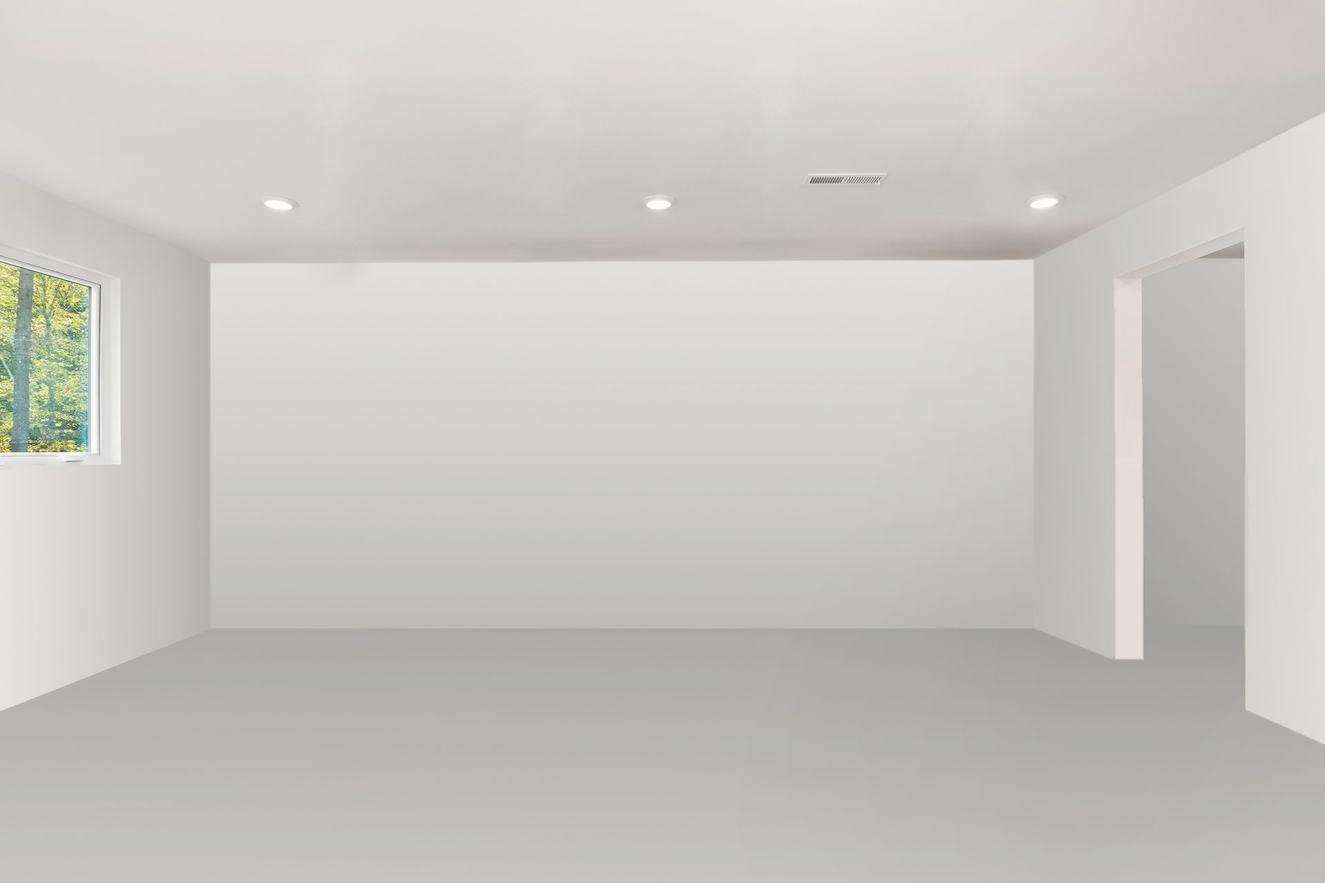 An empty room with white walls and a window.