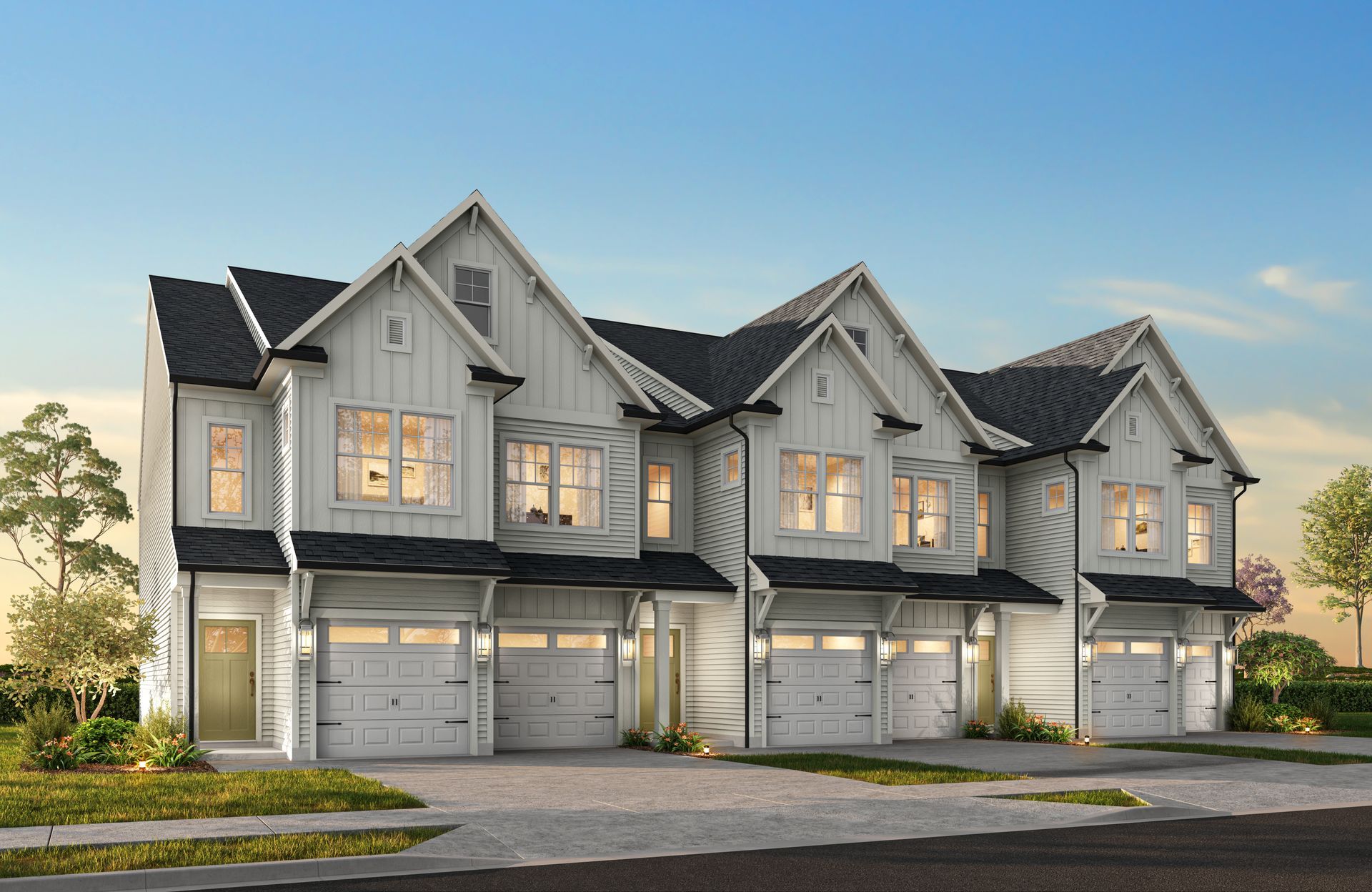 A rendering of a row of white houses with black roofs and garages.