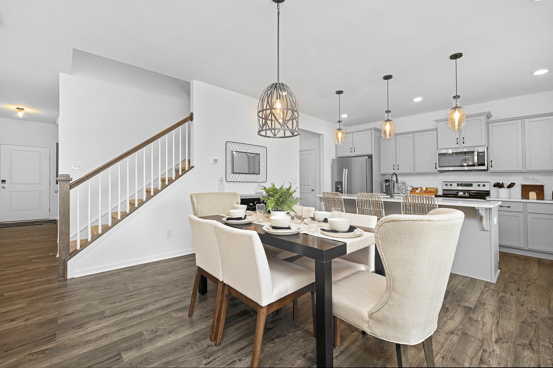 There is a dining room table and chairs in the middle of the room.