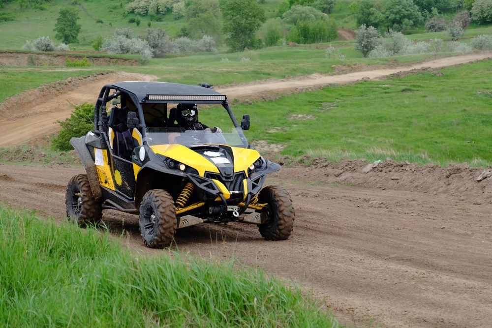 Side by Side ATV on Dirt Track — Vehicle Servicing in Glen Innes, NSW