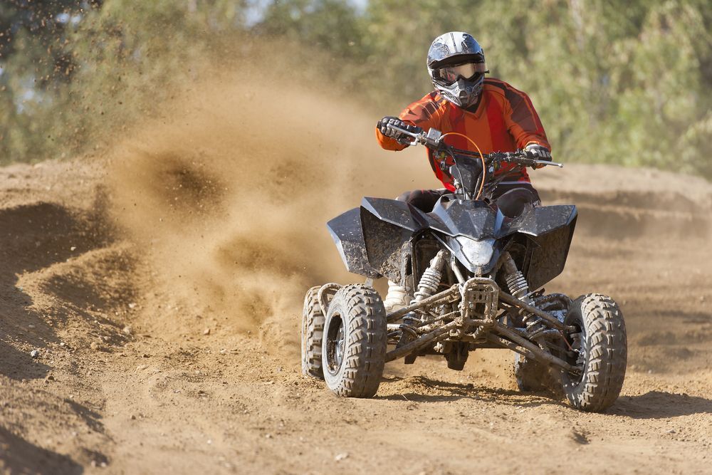 Riding a Quad Bike — Vehicle Servicing in Glen Innes, NSW