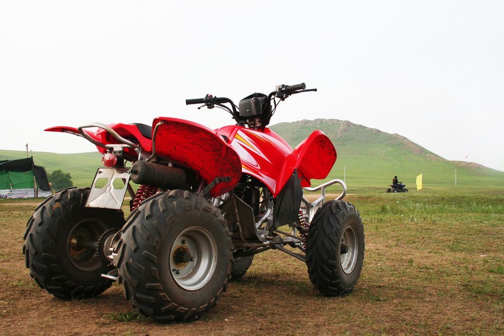 Red Quad Bike — Vehicle Servicing in Glen Innes, NSW