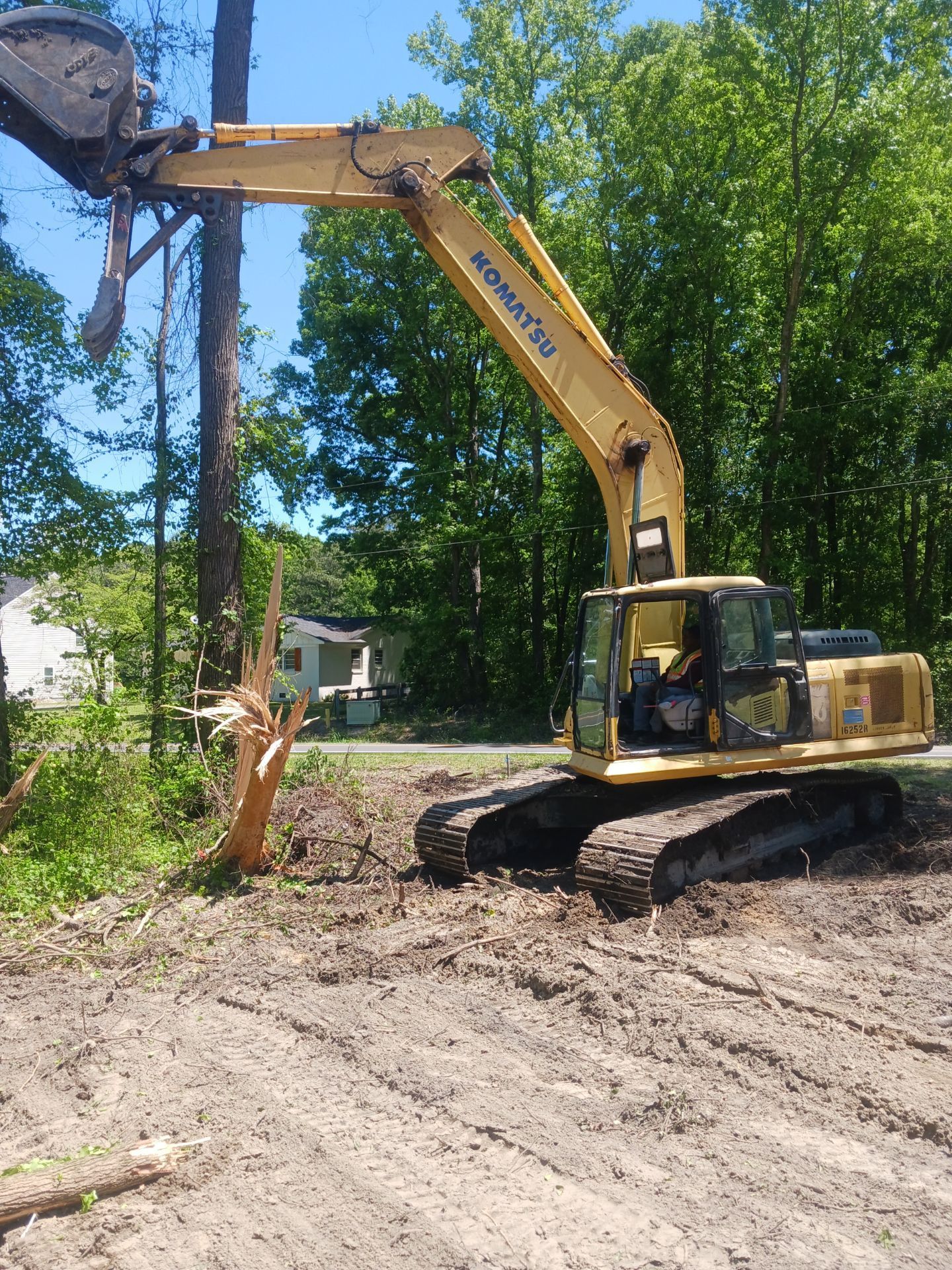 A Bulldozer Moving Dirt On A Construction Site — Youngsville, NC — Dontavius Landscaping