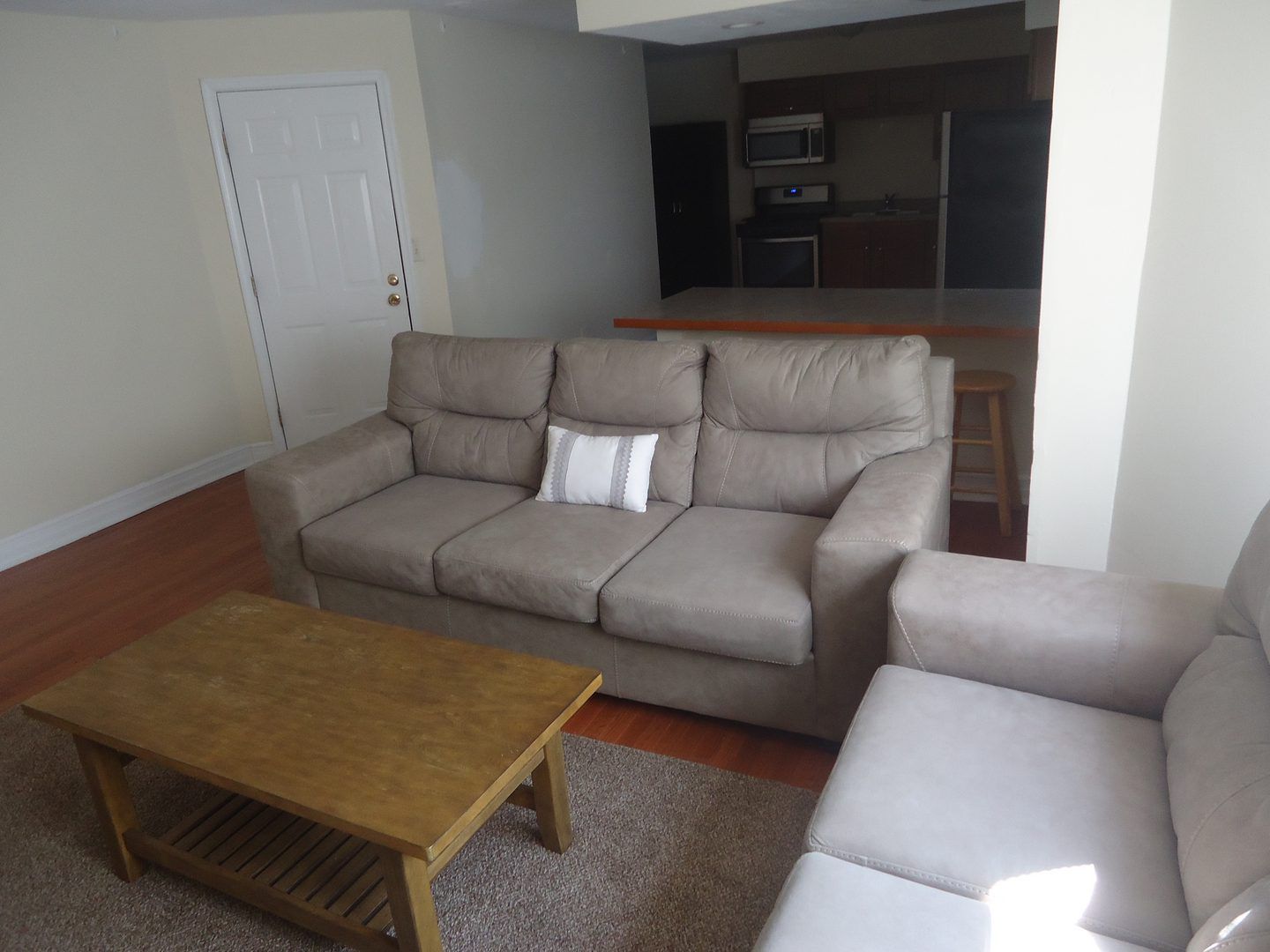 A living room with a couch and a coffee table