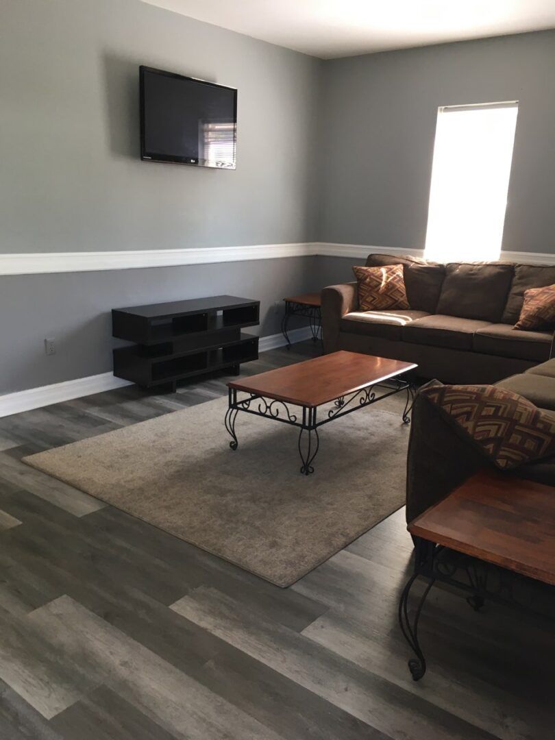A living room with a couch and a coffee table