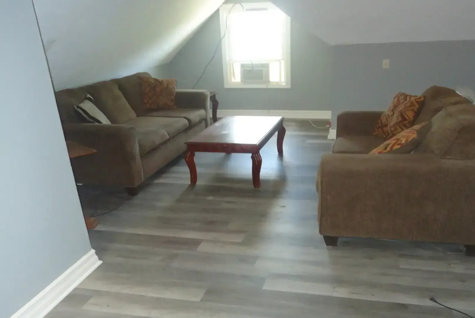 A living room with two couches and a coffee table