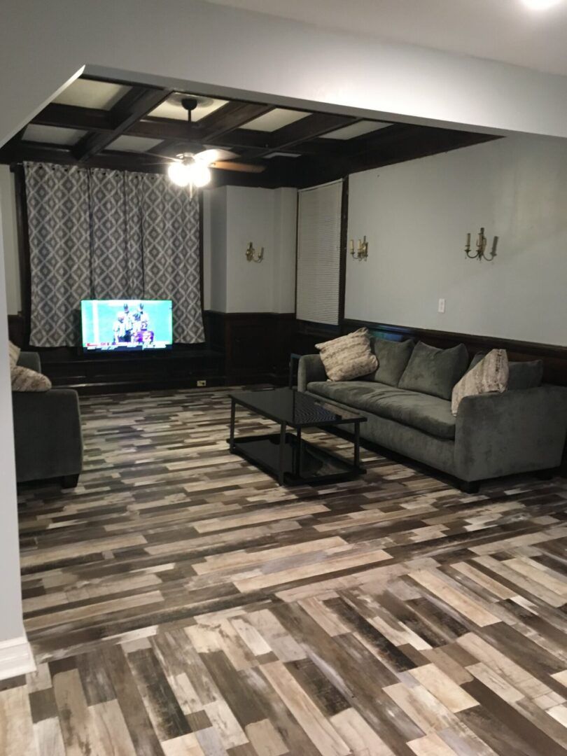 A living room with a couch and a television