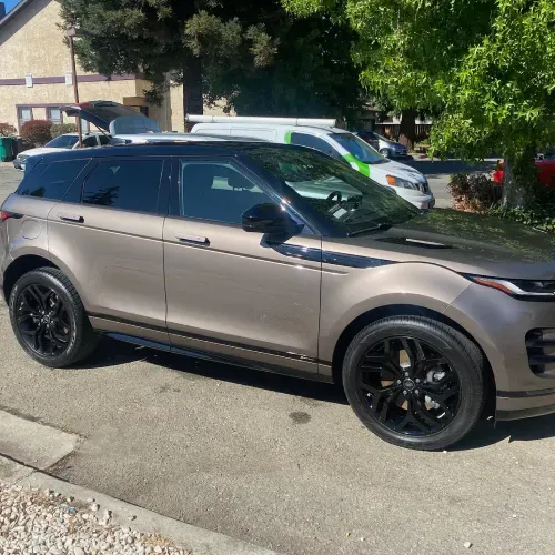 a range rover is parked on the side of the road