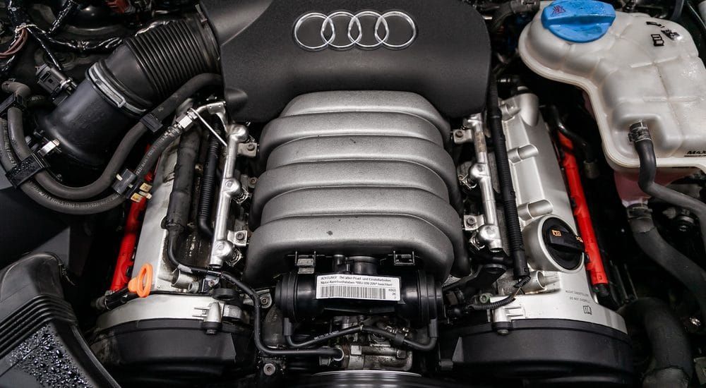 A close up of the engine of an audi car