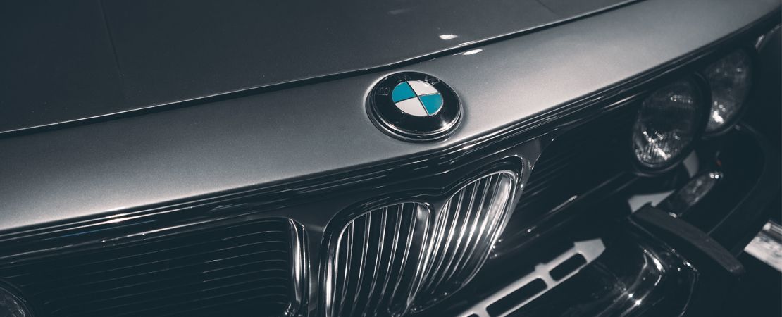 A close up of the hood of a bmw car.
