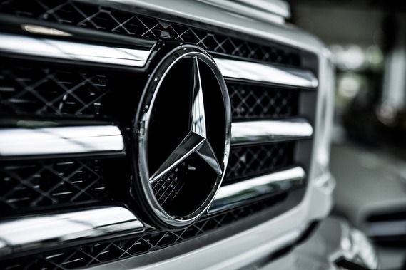 A close up of the front grille of a mercedes benz car.