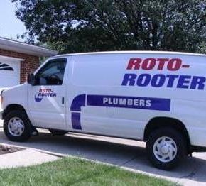 Plumbers Holding Tree Root – Apple Valley, CA – Roto-Rooter Plumbers and Septic Service