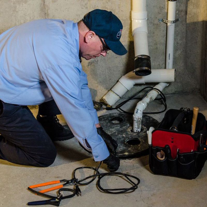 Plumber Working on a Sump Pump - Apple Valley, CA - Roto-Rooter Plumbers and Septic Service