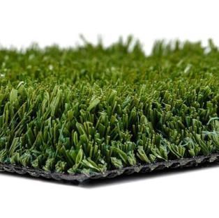 A close up of a piece of artificial grass on a white background.