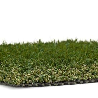 A close up of a piece of artificial grass on a white background.