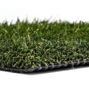 A close up of a piece of artificial grass on a white background.