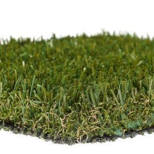 A close up of a piece of artificial grass on a white background.