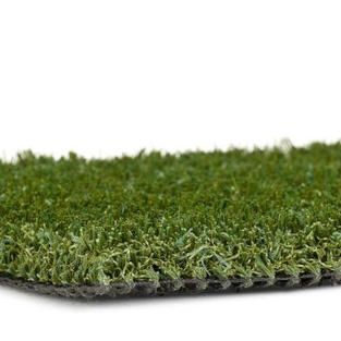 A close up of a piece of artificial grass on a white background.