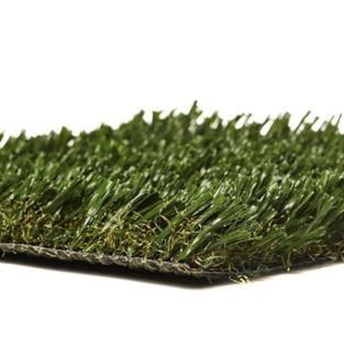 A close up of a piece of artificial grass on a white background.