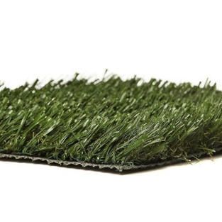 A close up of a piece of artificial grass on a white background.