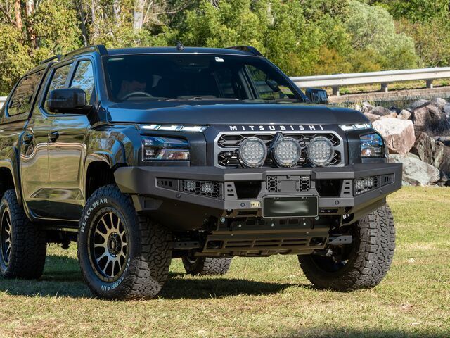 A Black Truck is Parked in a Grassy Field — TJM Albury Pty Ltd in South Albury, NSW