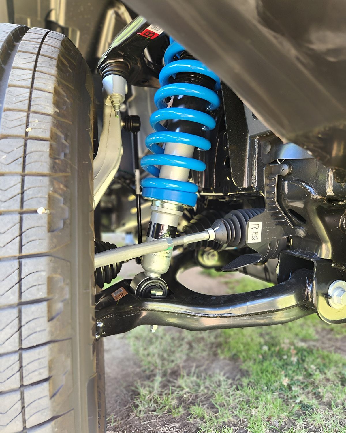 Blue Coil-Over Shock Absorber On A Vehicle's Front Suspension — TJM Albury Pty Ltd in South Albury, NSW