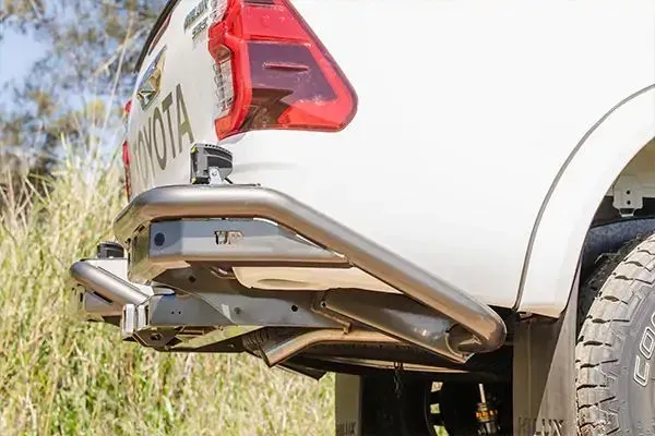 White Toyota pickup truck's aftermarket steel bumper. — TJM Albury Pty Ltd in South Albury, NSW