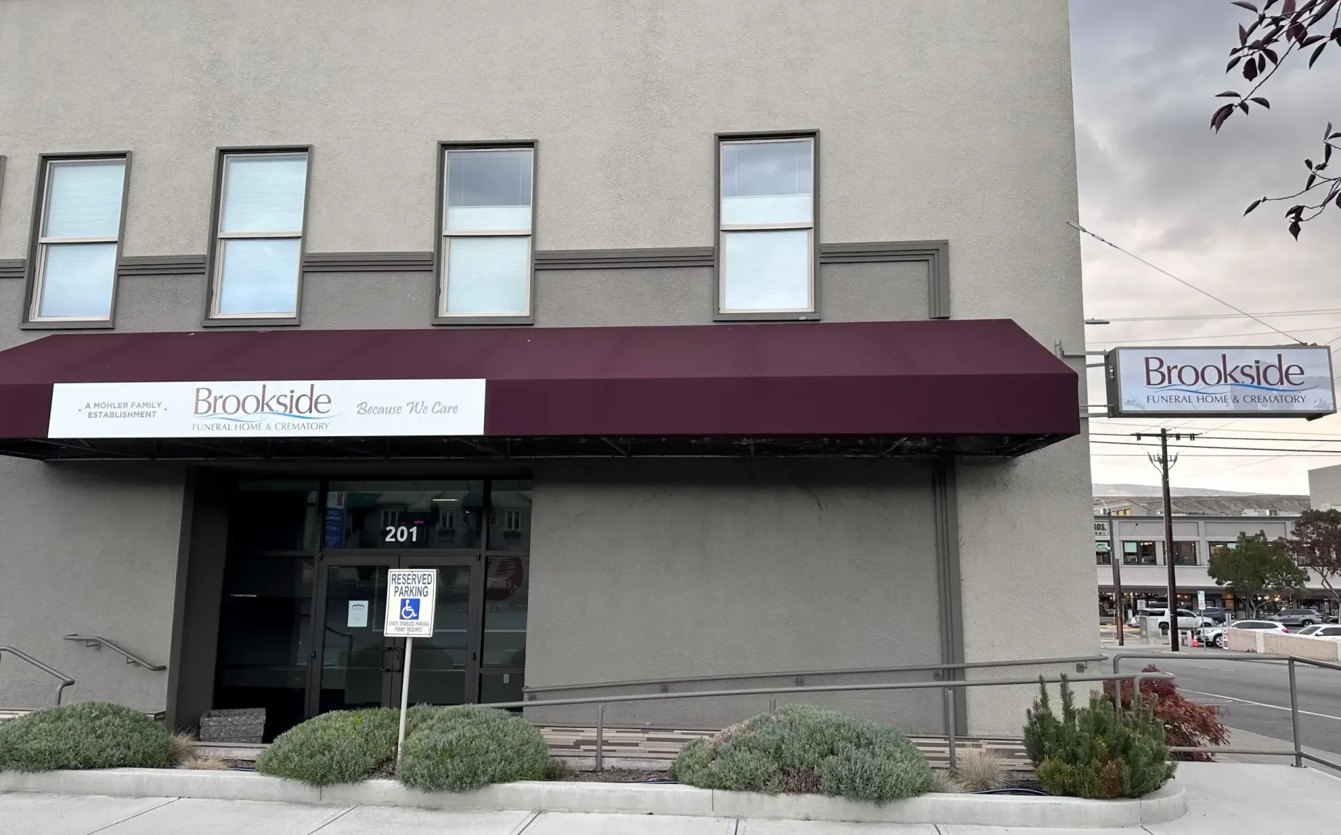 Building exterior with awning and sign: