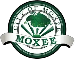 City of Moxee seal with a green design and text.