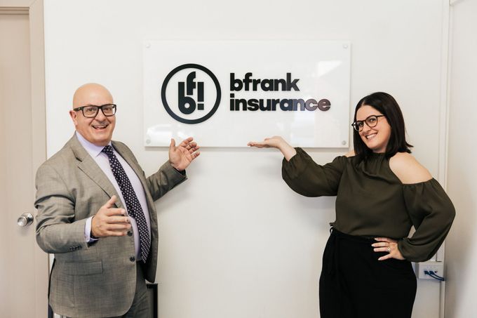 Man and Woman Standing in Front of Banner | Norwood, Sa | Bfrank Insure