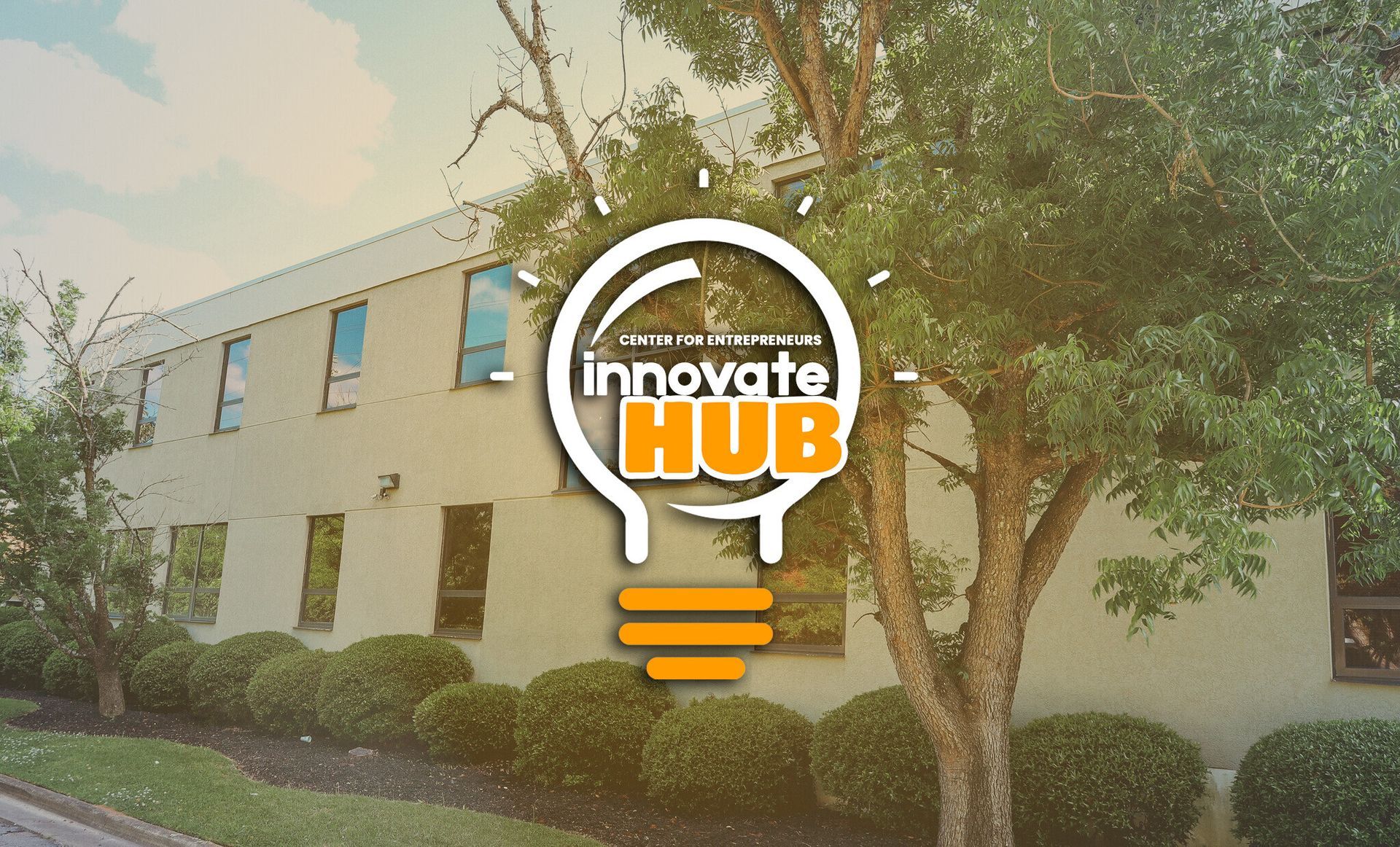 A building with a light bulb in front of it that says innovate hub