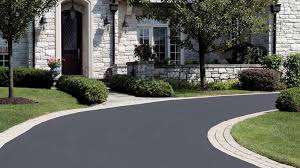There is a curved driveway leading to the front of a house.