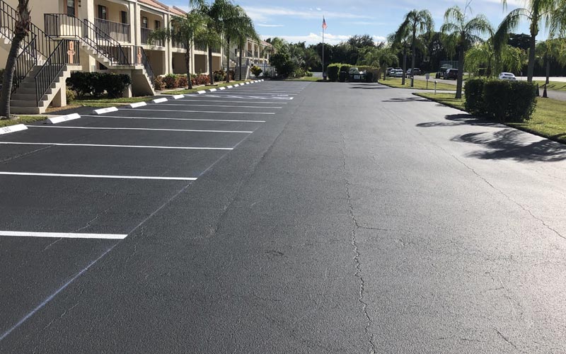 A parking lot with a lot of cars parked in it