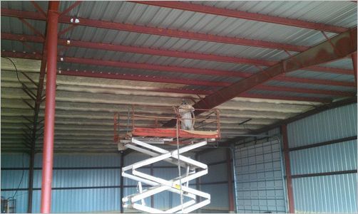 Worker Spraying Foam Insulation on Roof — Insulation in Tangent, OR