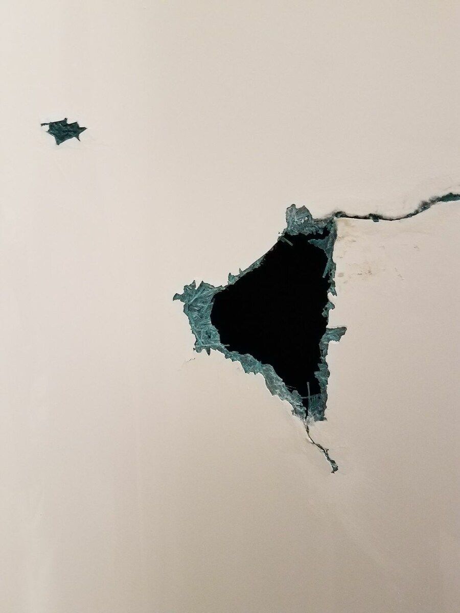 A hole in a wall that looks like a triangle